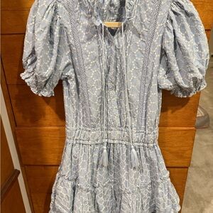 blue embroidered dress featuring short puffy sleeves and ruffled tiered hem